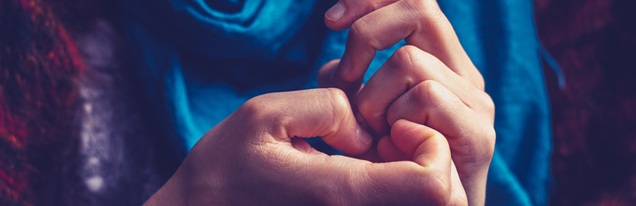 Close up of two hands with fingers touching. 