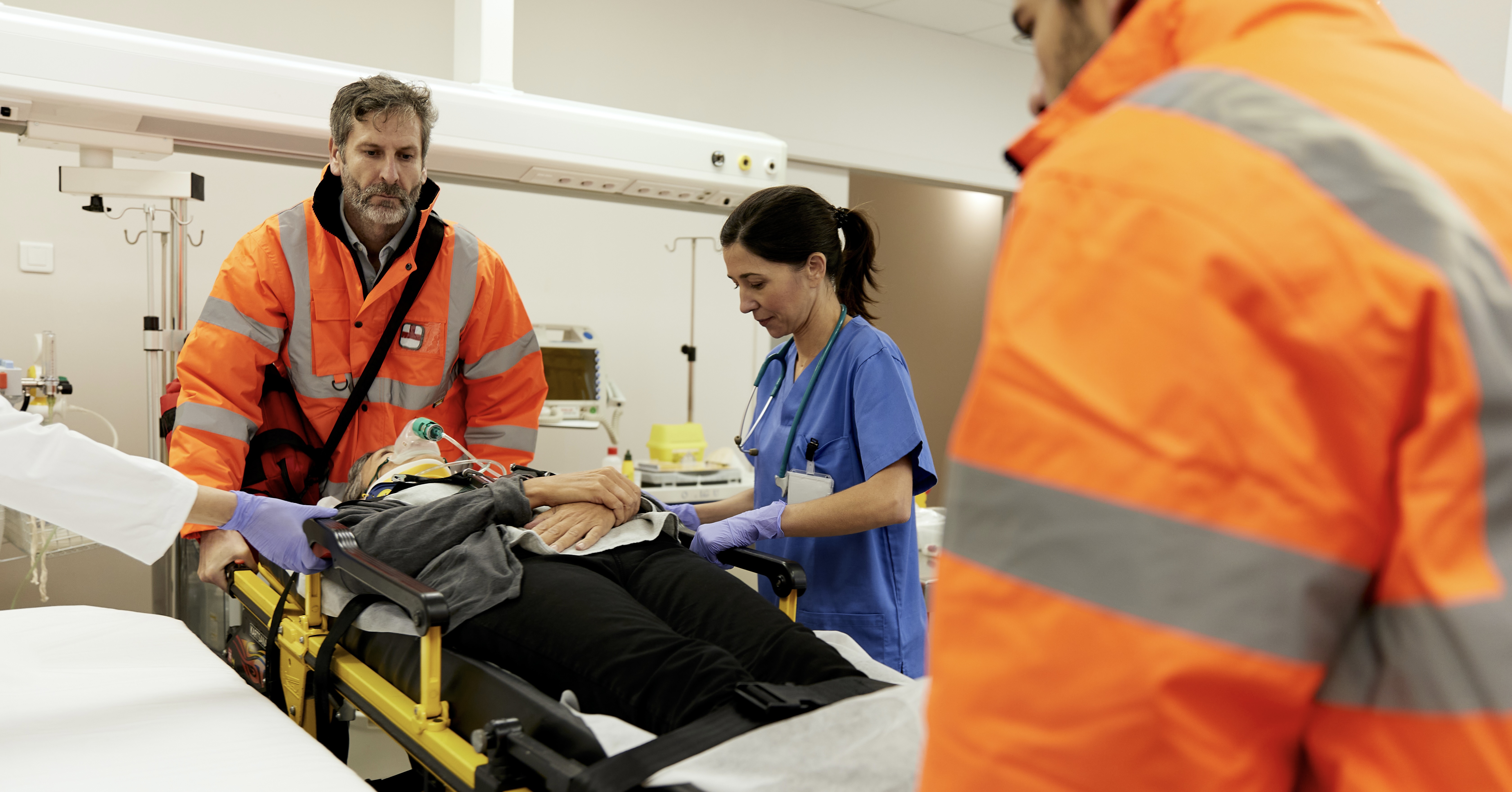 Trauma doctor assisting patient.