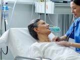 Female doctor performing routine exam on senior patient.