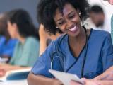 Female nurse in classroom setting.