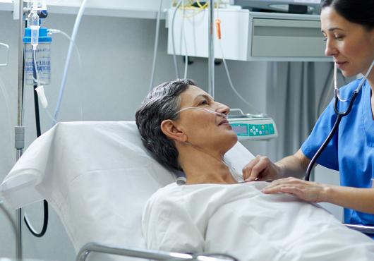 Female doctor performing routine exam on senior patient.