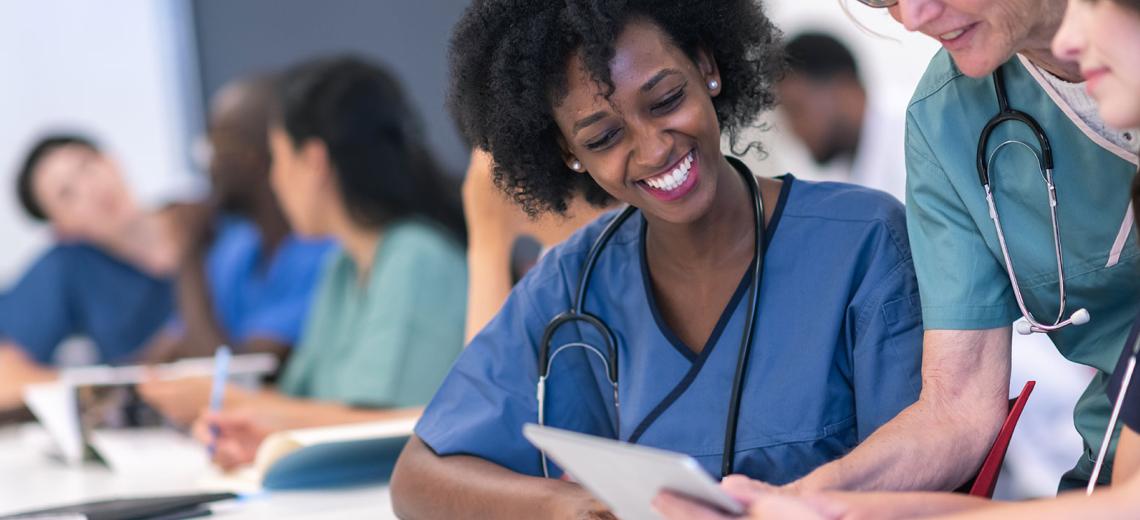 Female nurse in classroom setting.